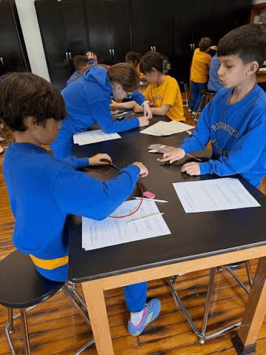 Students participating in an Energize Youth hands-on clean energy workshop